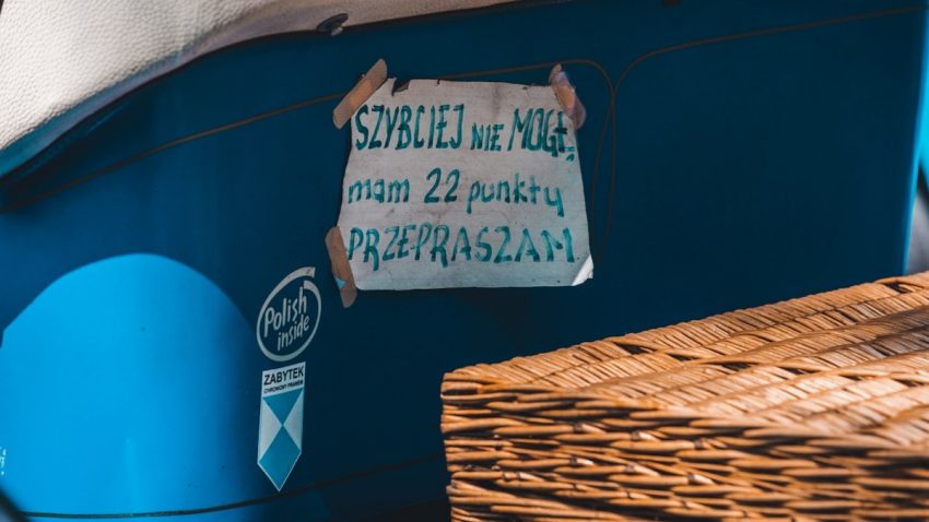 a sign on the side of a blue boat